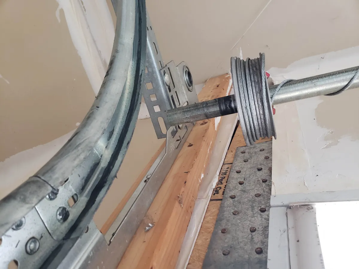 Garage door lift cable wound on the drum after an iFix cable replacement