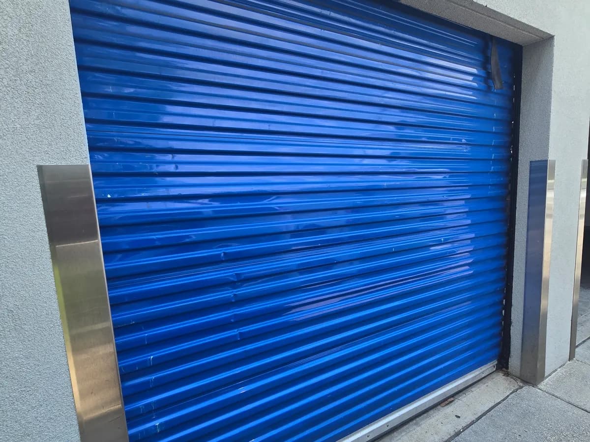 Commercial rolling steel garage door serviced by iFix